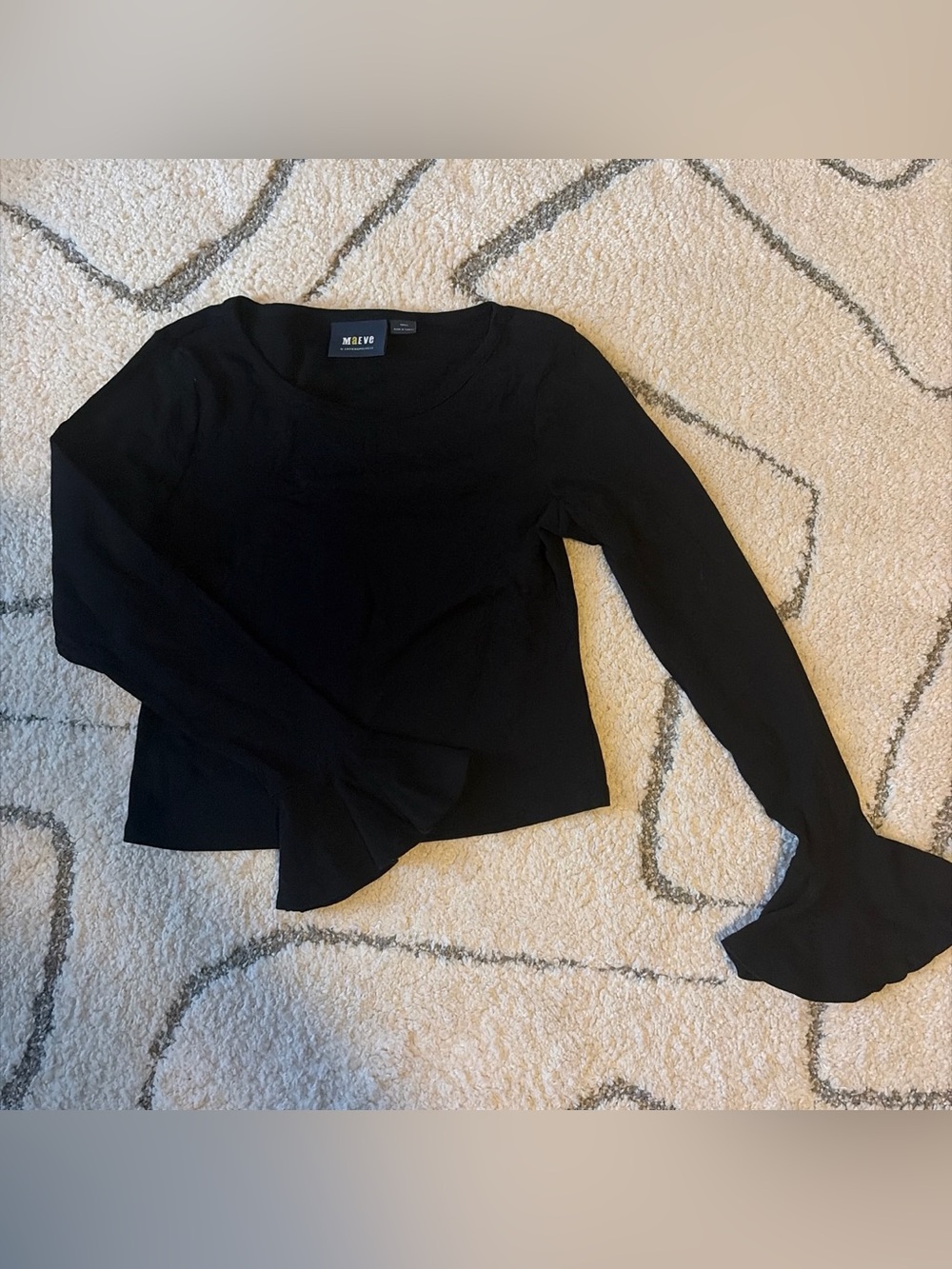 Anthropologie Black Long-Sleeve Scoop Neck Top with flowy sleeves at bottom